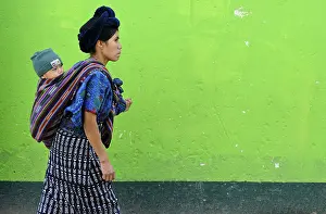 Mayan woman carrying a child, Antigua