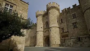 Medieval castle with striking towers under a clear sky