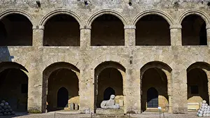 Medieval fortress with arcades and old stone walls