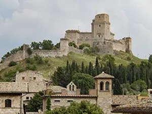 Medieval fortress rocca maggiore rising above the rooftops of assisi