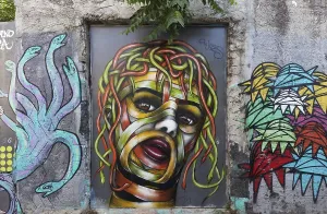 Medusa, female head with hair of colourful snakes
