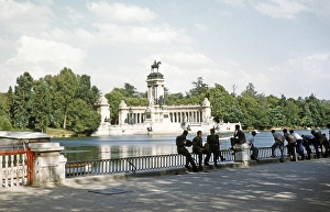 Men at the boating lake in El Retiro Park, equestrian statue, monument to King Alfonso XII, Madrid, Spain 1959