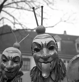 Men with mask stick their tongues out