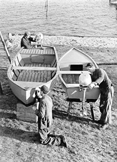 Three men repairing a boat, 1960s