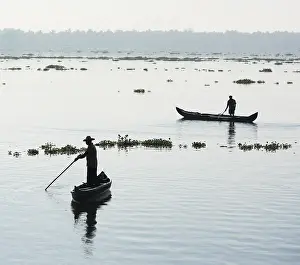 Men in small boats, Vembanad Lake