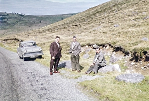 Three men in suits in a rural moorland landscape near a Vauxhall Victor MkII Type F, Northern Ireland, late 1950s, circa 1960s