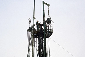 Men at work on a drilling rig in the oil exploration industry in the area of Dhahran, Saudi Arabia, Arabian Desert 1979, Asia
