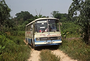 Mercedes Benz coach on a dirt road to Vaama, Sierra Leone, West Africa 1978, Africa