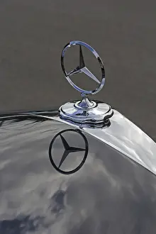 Mercedes star, with a reflection