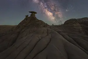 A mesmerizing view of the Milky Way shining brightly over the unique sandstone formations in Goblin Valley State Park