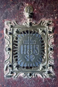 Metal plate fixed on door inside basilica of bom jesus at velha