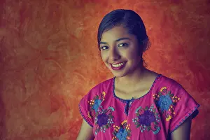 Mexican woman with mayan dress latin ethnicity on orange background