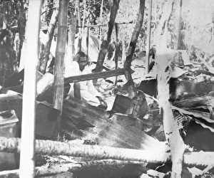 In midst the destruction caused by riots between Hindus and Muslims a man in grief in Noakhali East Bengal