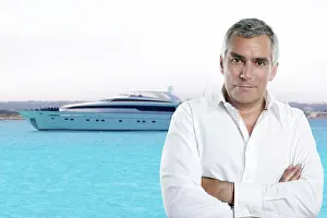 Millionaire senior posing in front a luxury yacht during summer vacation