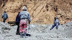 Framed Print : Miners in different clothes stand or sit in a barren Framed Print : Miners in different clothes stand or sit in a barren