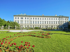 Mirabell Gardens with Mirabell Palace, blue sky, tulips, Salzburg, Austria, Europe