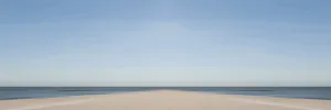 Mirrored picture, blurred, waves on Sylt North Sea beach