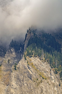 Category Mountain Landscapes Prints: Misty mountain landscape with steep cliffs and dense forest