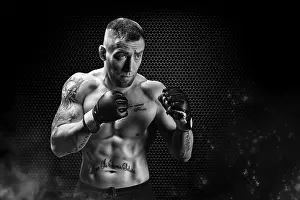 Mixed Martial Arts fighter posing on a metal grid background