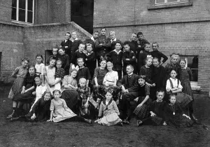 Mixed school class with teacher, ca