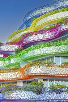 Modern apartment building with colourful balcony decorations