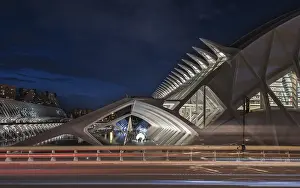 Modern architecture illuminated at night with road and motion blur
