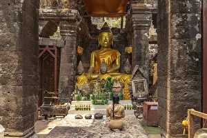Category Buddhism Prints: Modern Buddha statues in the central sanctuary of the mountain temple Wat Phu