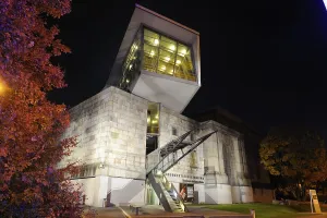 Modern building at night with unusual architecture and lighting