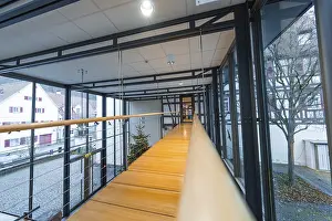 Modern glass overpass with wooden walkway