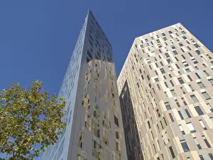 Framed Print : Two modern high-rise buildings with glass facades under a clear blue sky