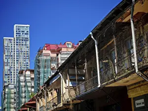 Modern and old architecture contrasting under clear skies