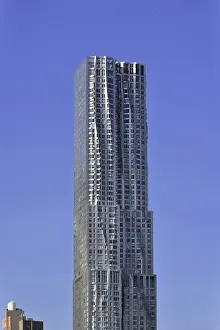 Modern skyscraper against a clear blue sky