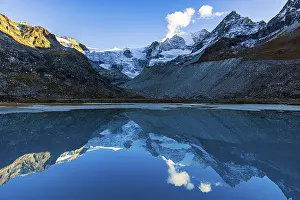 The Moiry glacier and mountain peaks are reflected in Lac de Chateaupre