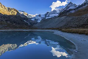 The Moiry glacier and mountain peaks are reflected in Lac de Chateaupre