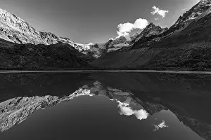 The Moiry glacier and mountain peaks are reflected in Lac de Chateaupre