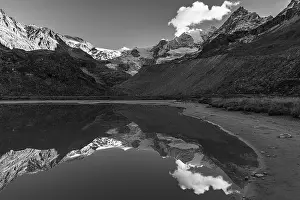 The Moiry glacier and mountain peaks are reflected in Lac de Chateaupre