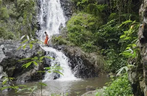 Category Buddhism Prints: Monk walking across a waterfall