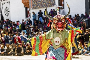 Monks with big wooden masks