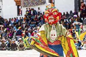 Monks with big wooden masks