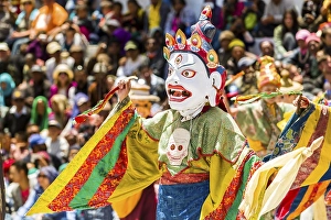Monks with big wooden masks