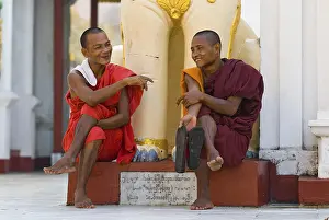 Two monks sitting and having a chat