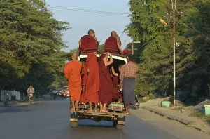 Monks on back of truck, Myanmar, Asia