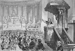 Monsignor farmer preaching from the pulpit in the Church of St