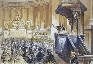 Monsignor farmer preaching from the pulpit in the Church of St