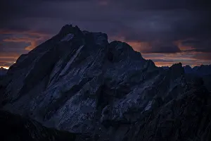 Montafon mountains with dramatic cloudy sky at sunrise