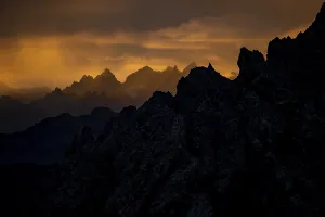 Montafon mountains with dramatic cloudy sky at sunrise