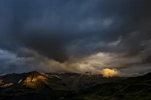 Montafon mountains with dramatic cloudy sky at sunset