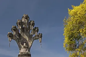 Monumental depiction of Buddha meditating under the protection of a seven-headed naga snake