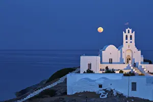 Full moon behind the monastery Chrisopigi on Sifnos