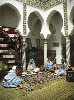Moorish woman making Arabian carpets